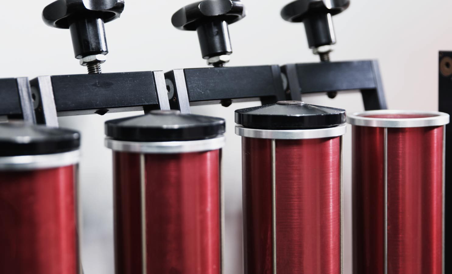 A bank of red production machines on the floor.