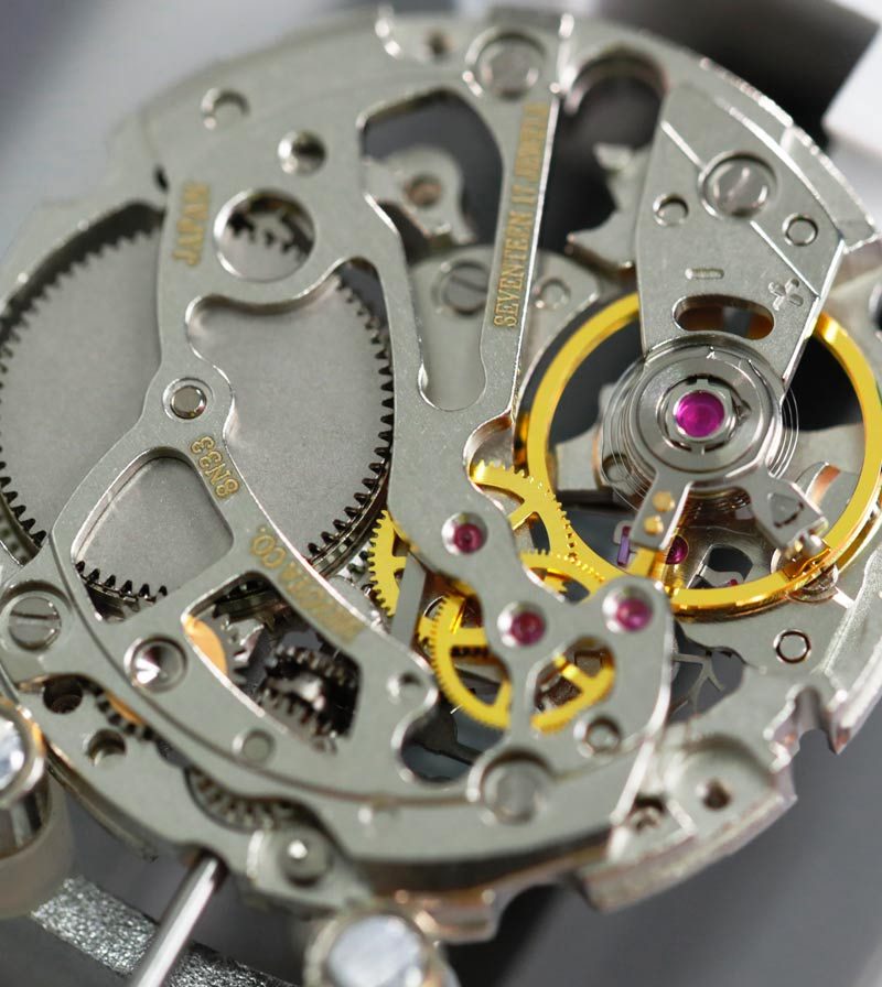 An automatic movement with the rotor and jewels exposed.